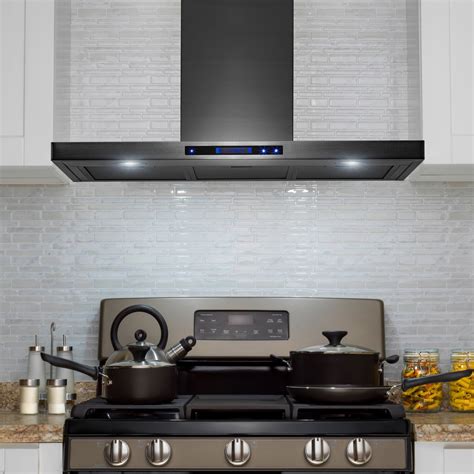 black range with stainless steel wall hood white cabinets|black kitchen exhaust hoods.